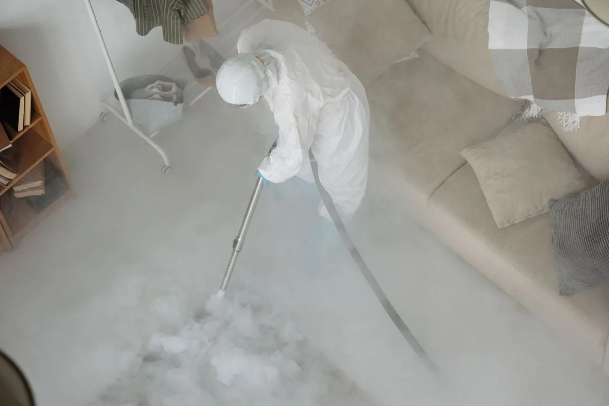 Biohazard cleanup technician in protective equipment, New Egypt, NJ